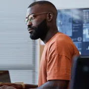 person sitting at laptop