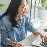 person sitting at laptop