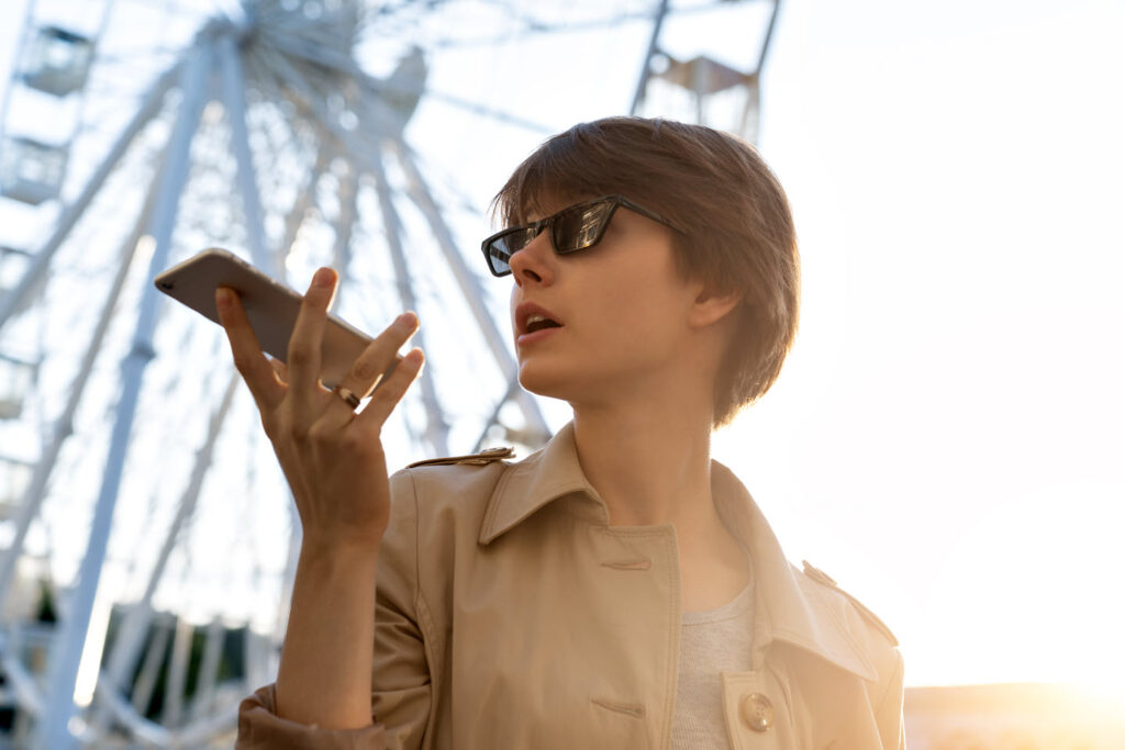 person speaking into mobile phone
