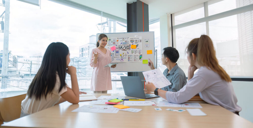 team looking at ui ux board