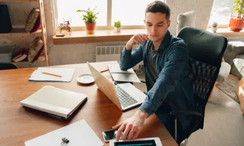 Man at desk and computer thinking of Testing Methods