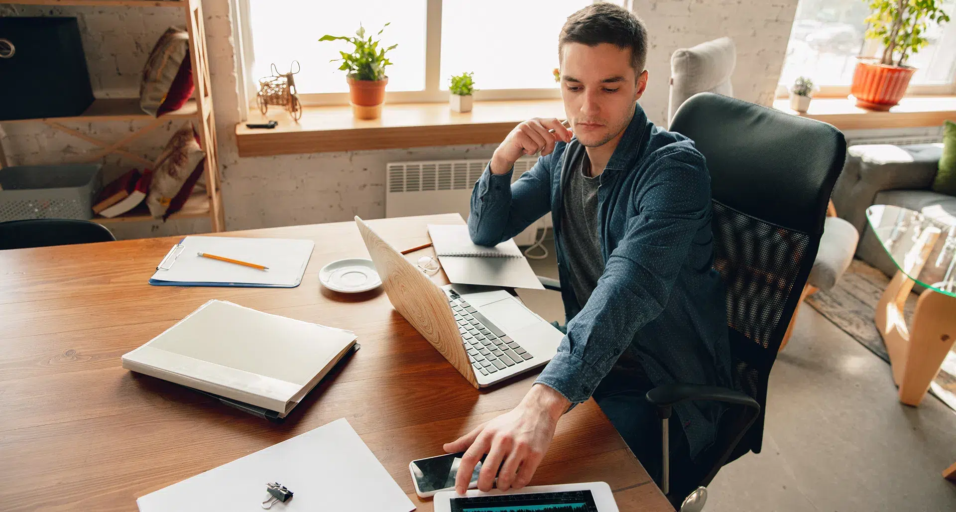 Man at desk and computer thinking of Testing Methods