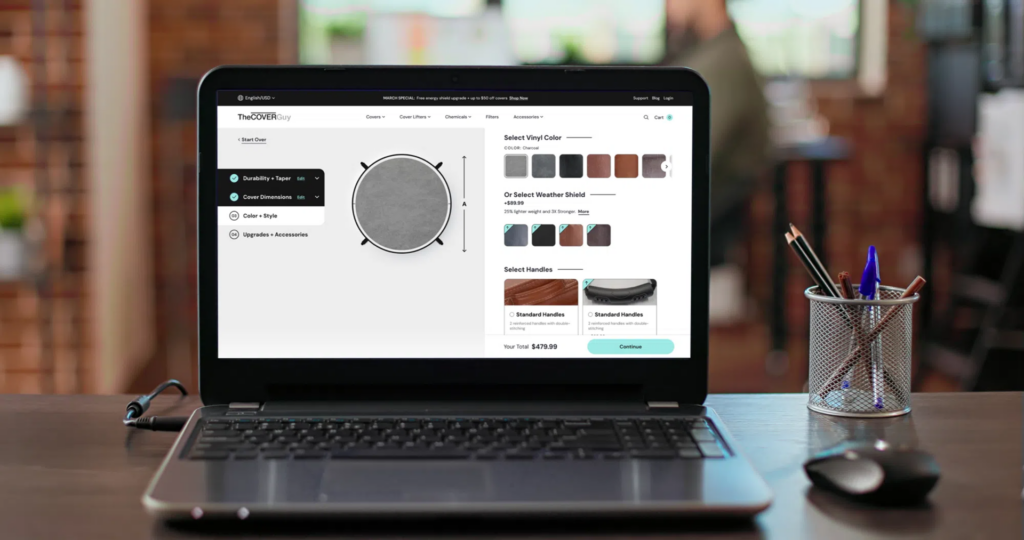 Laptop on a desk.  The Cover Guy customization page is showing on the laptop.